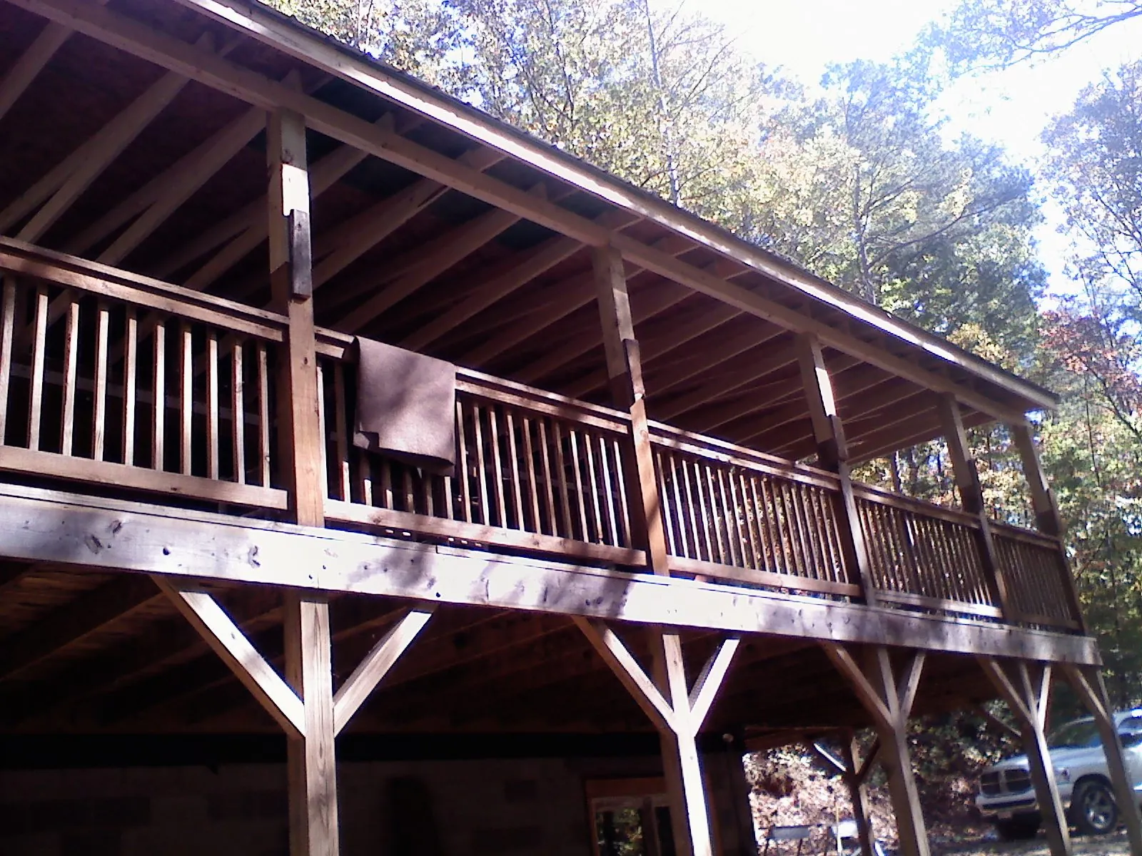 Timber framing under a new elevated porch and deck — Roof Leak Repair in West Des Moines by Roofing Brothers